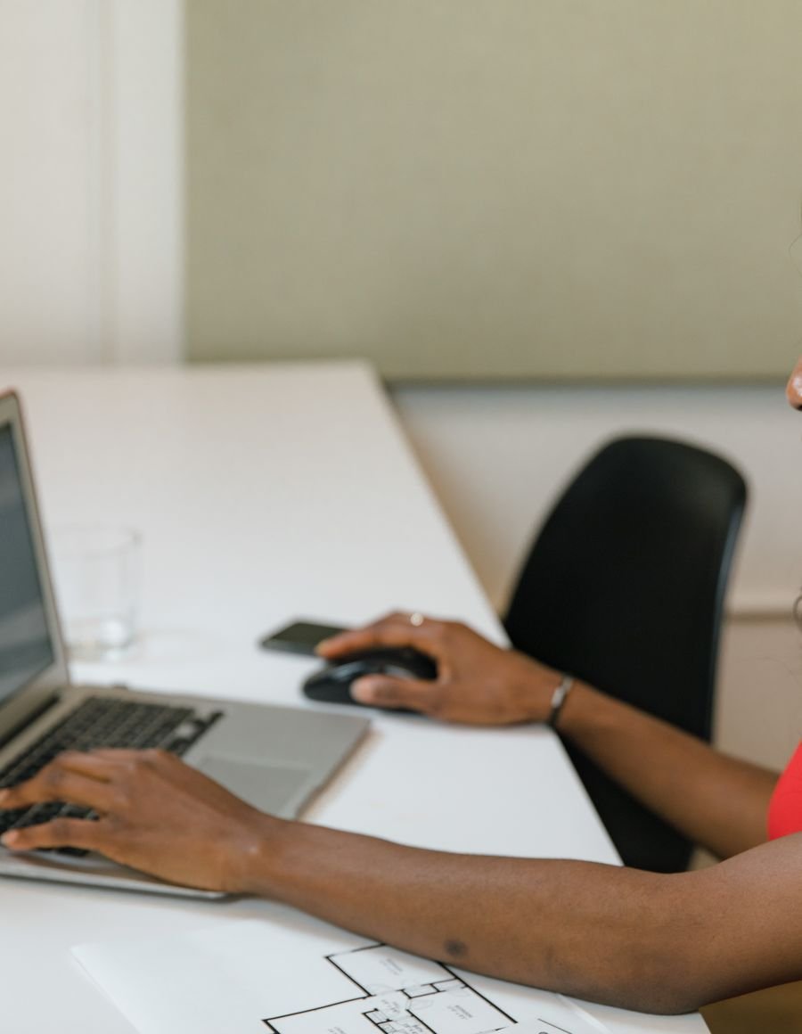 A woman working at an office desk.
