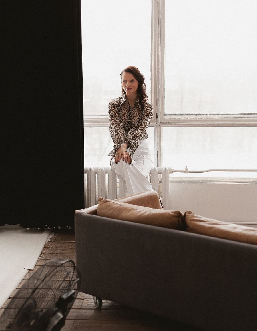 A woman in a modern living room.