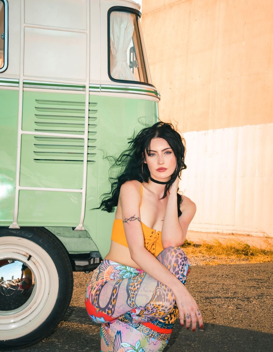 A fashion model in a street setting.