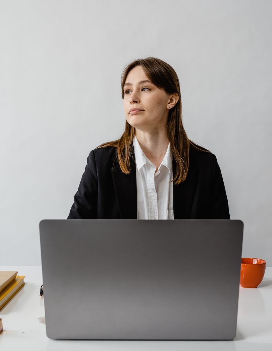 A woman working at a desk.